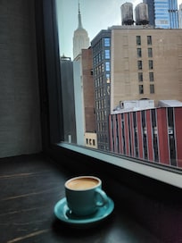 Complimentary espresso on the room. View of Empire State Building.