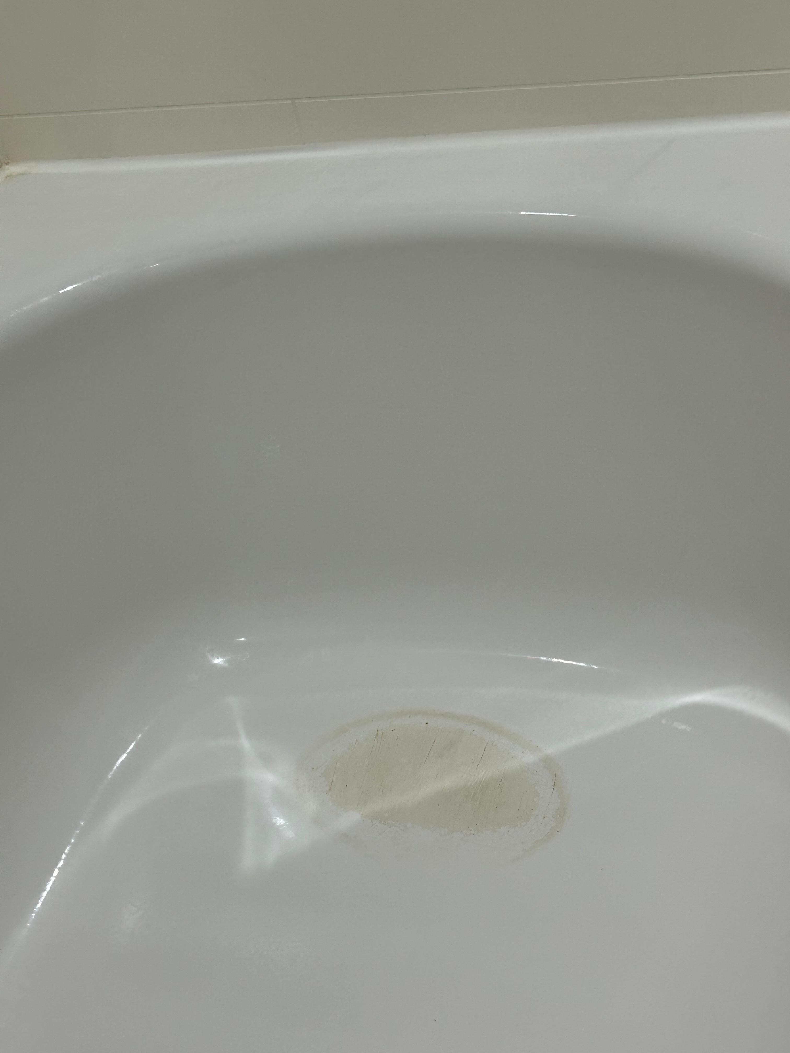 Stains in back of tub