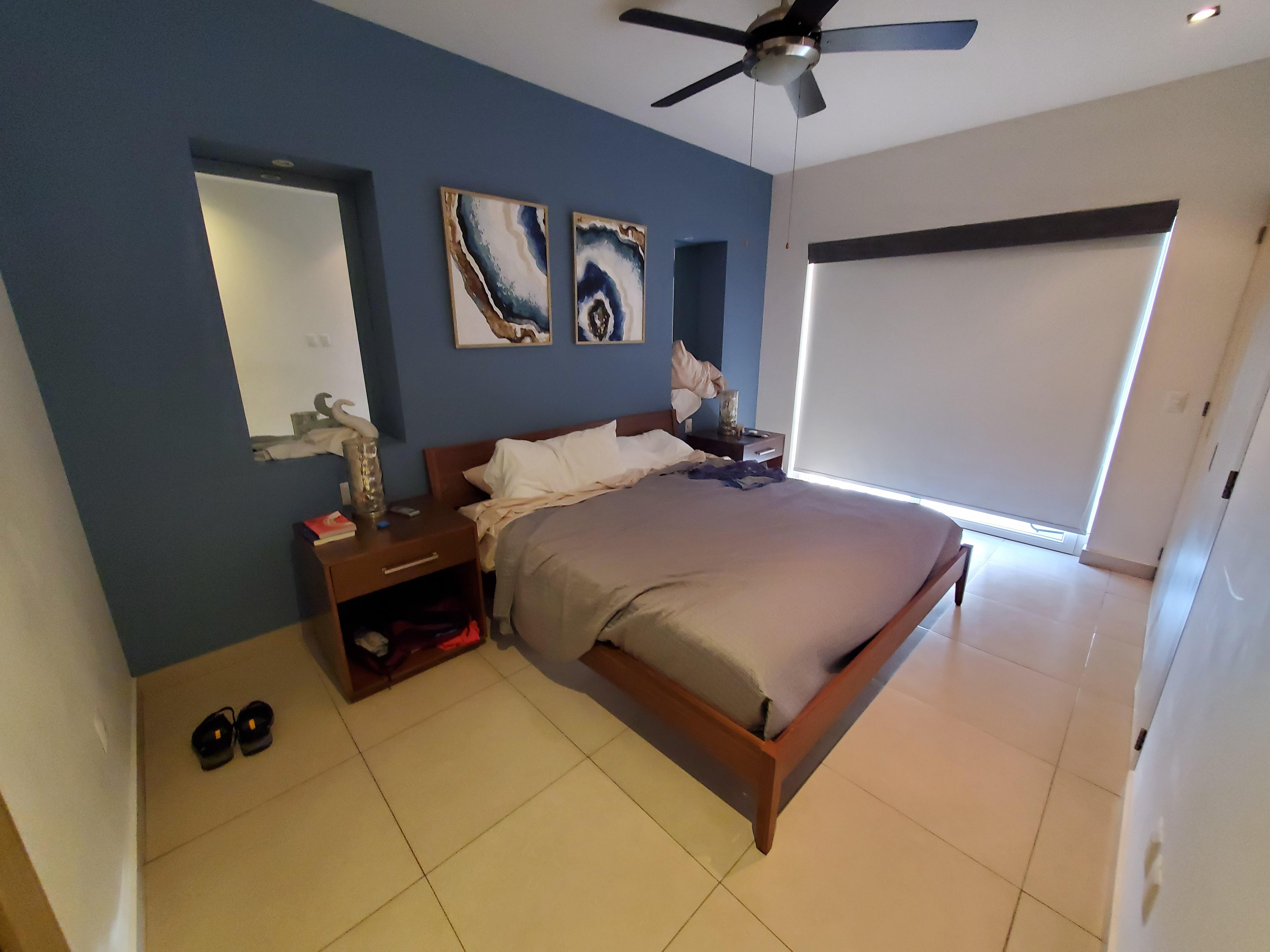 Bedroom. Small balcony on the other side of the shades that looks over the town