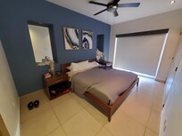 Bedroom. Small balcony on the other side of the shades that looks over the town