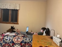 My youngest relaxing with moose head decor.