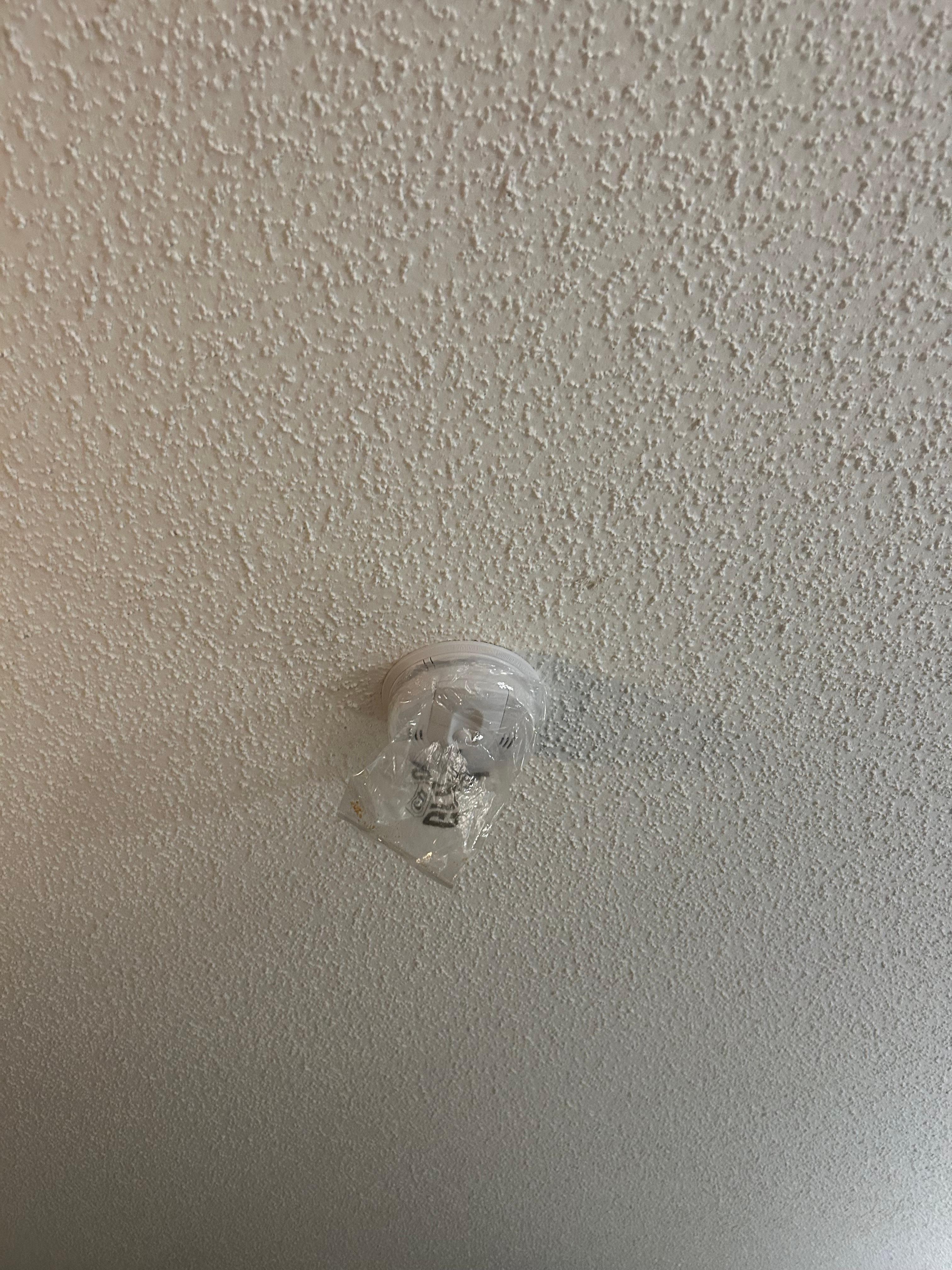 Plastic over smoke alarm.