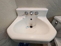 Sink with no stopper or soap.