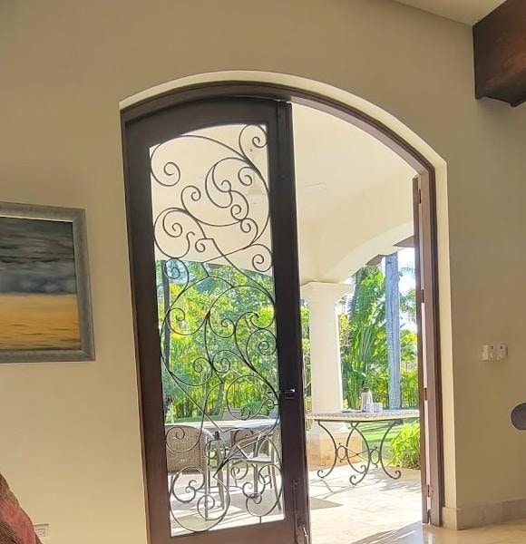 Wrought Iron w/o barrier between inside and outside.  This is the back door.  Front was the same.