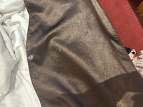 Stains on bed cover