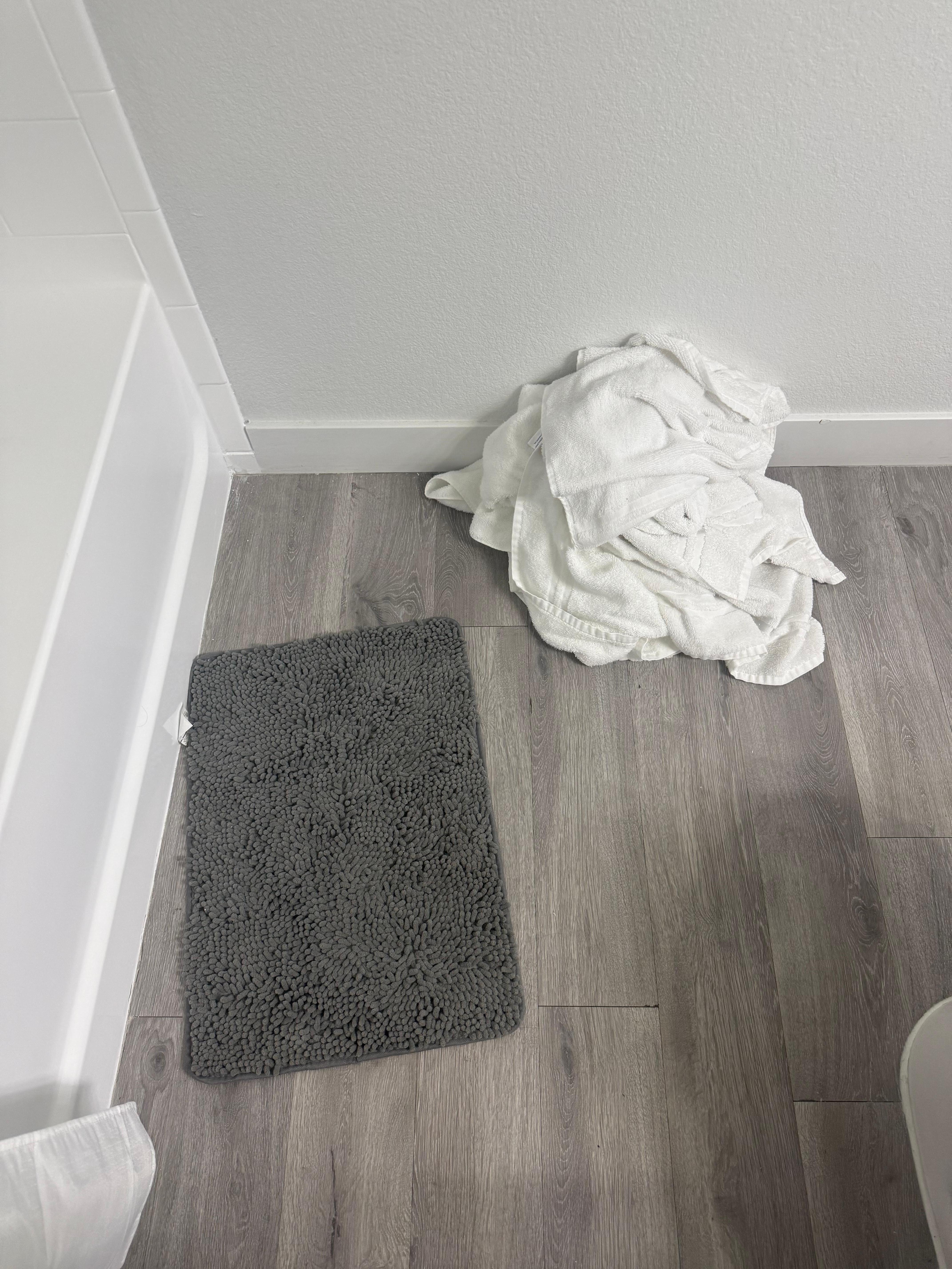 Dirty towels on the floor