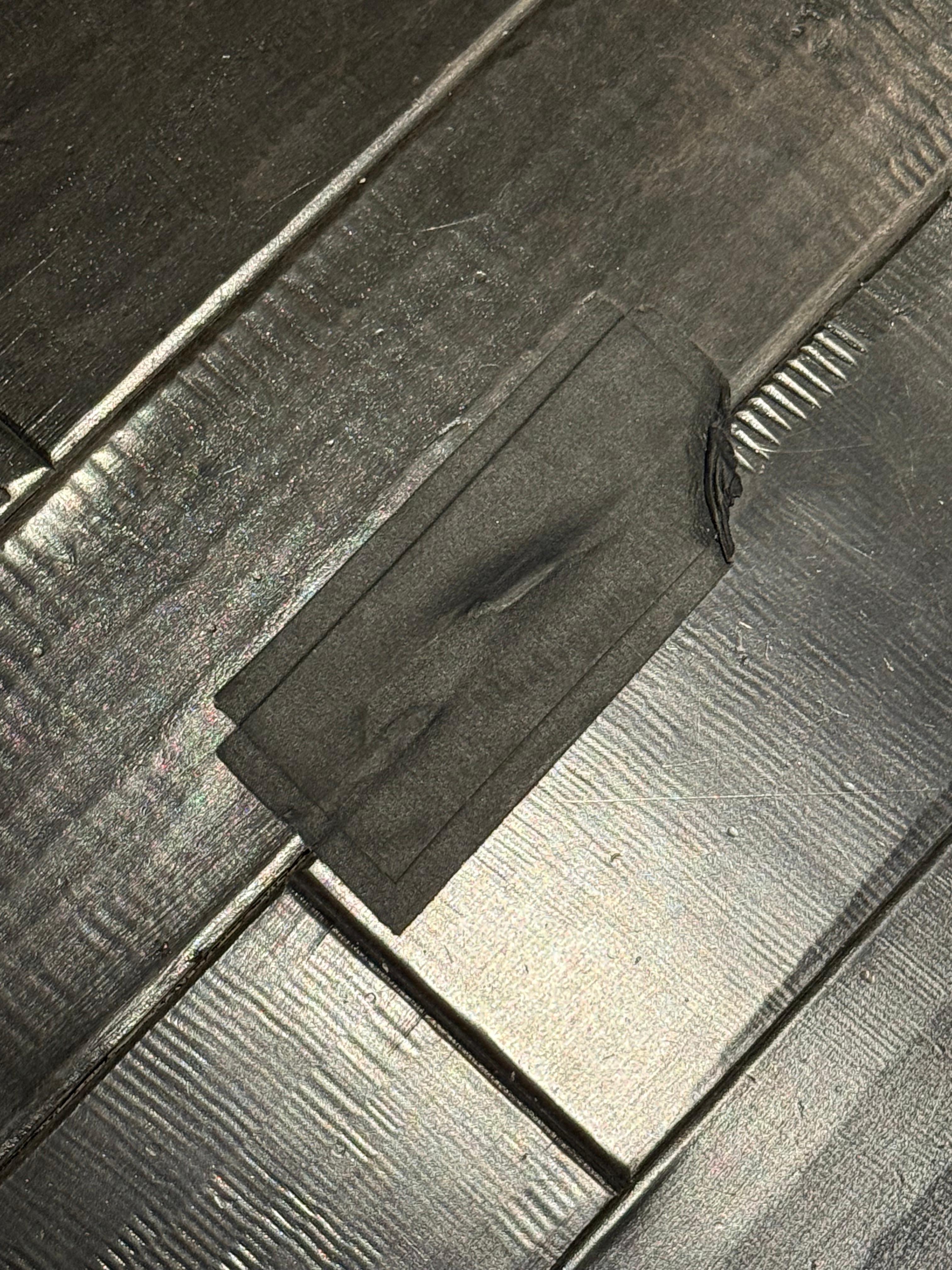 Floor tile taped down