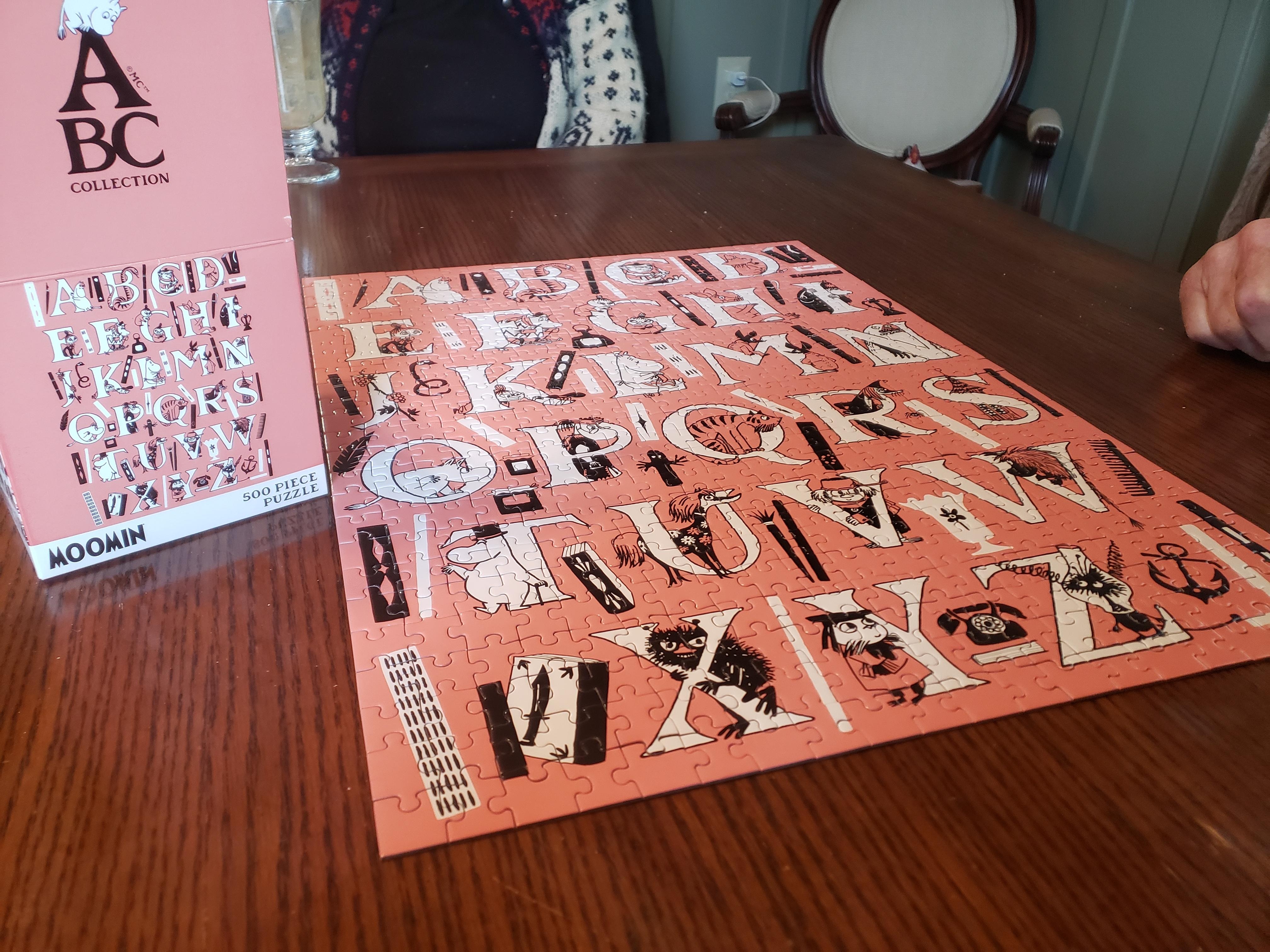 The dining room table is large and perfect for family games or serious puzzle action