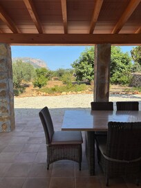 Large stunning table at rear of property that is breezy and shady from noon onwards. BBQ is high end too.