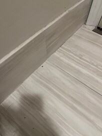Dirty floors of bathroom in new room
