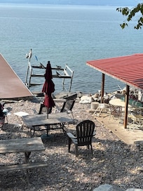 Broken boat launch, old rusted and broken patio furniture and boating trash