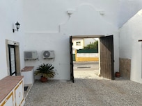 Entrance to the courtyard/parking is through a very narrow gate. If your vehicle is exceptionally wide, you might have to park on the street.