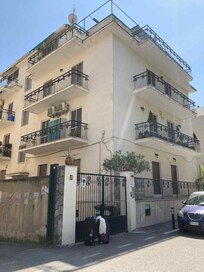 The building - the rooms are at the back, and other side
