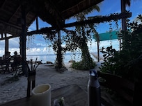 The beach from inside the restaurant.