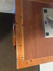 Cigarette burns on night stand