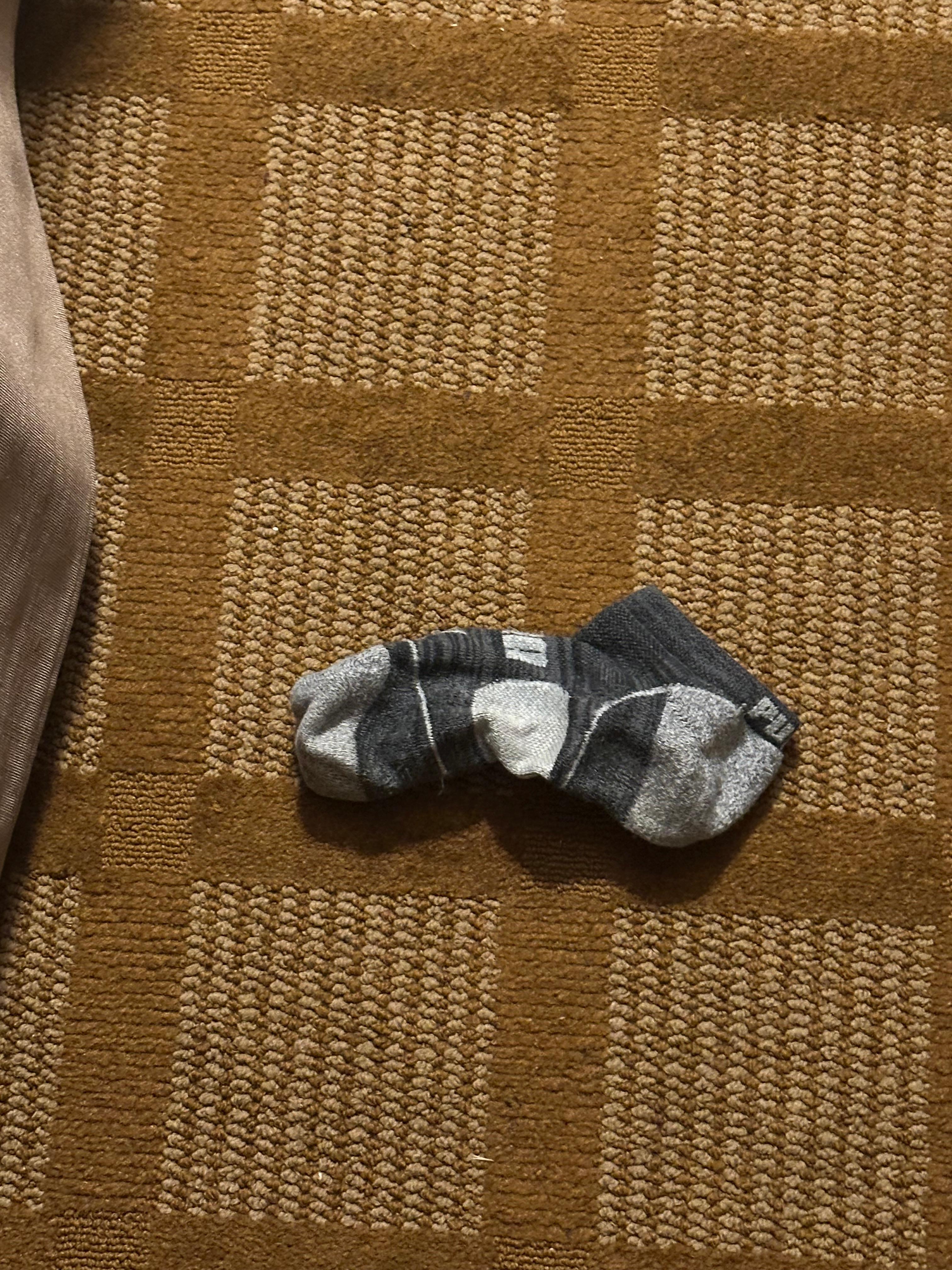 Someone’s sock left in the room from previous stays.  