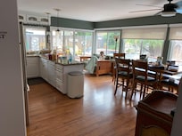 Kitchen/dining room and view of patio