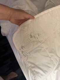 Another side of the bed - this comforter should have been tossed and never used on guests. Sheets were dirty also - but hard to photograph.
