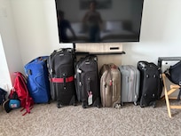 Storing luggage under the TV