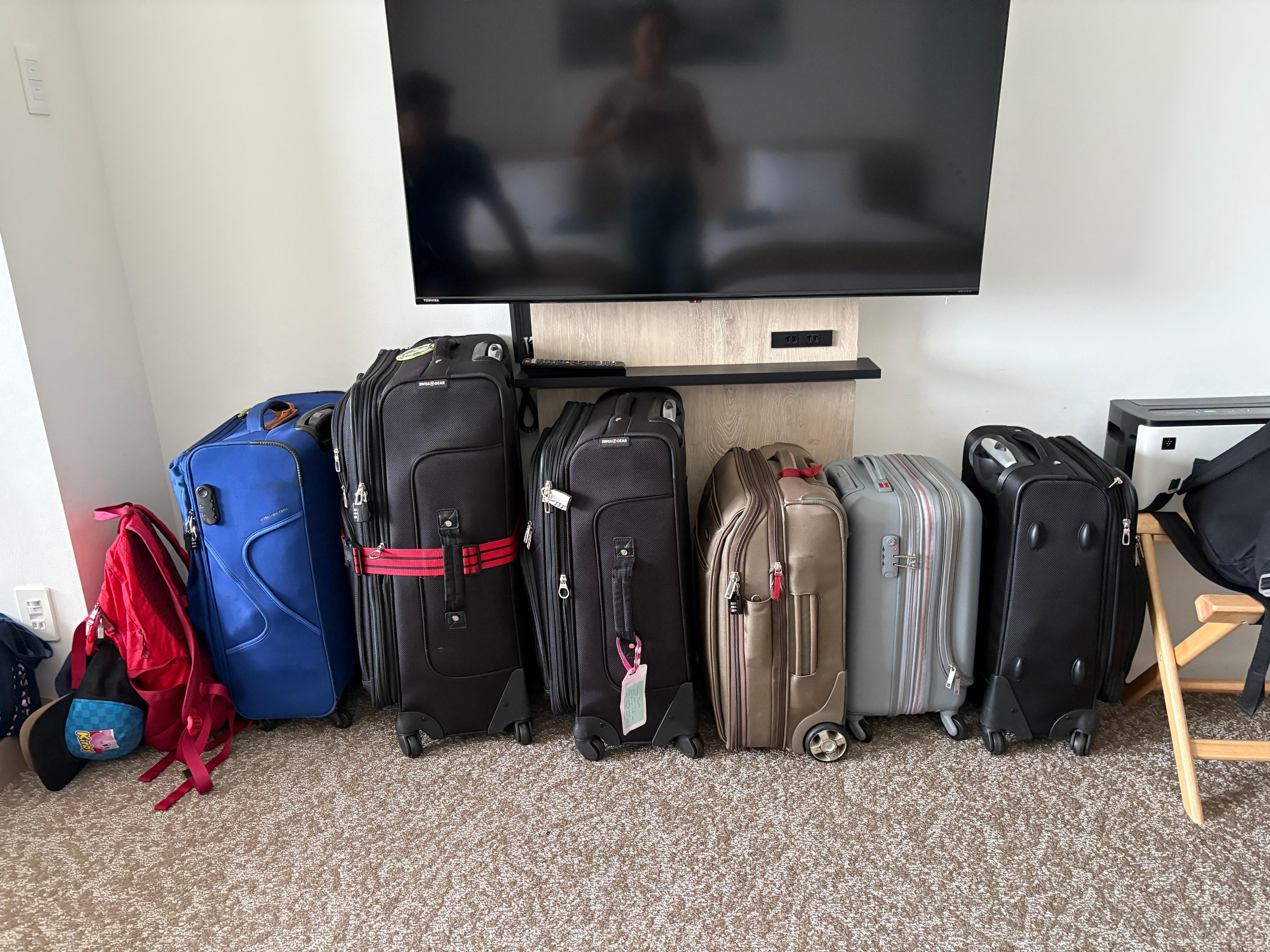 Storing luggage under the TV