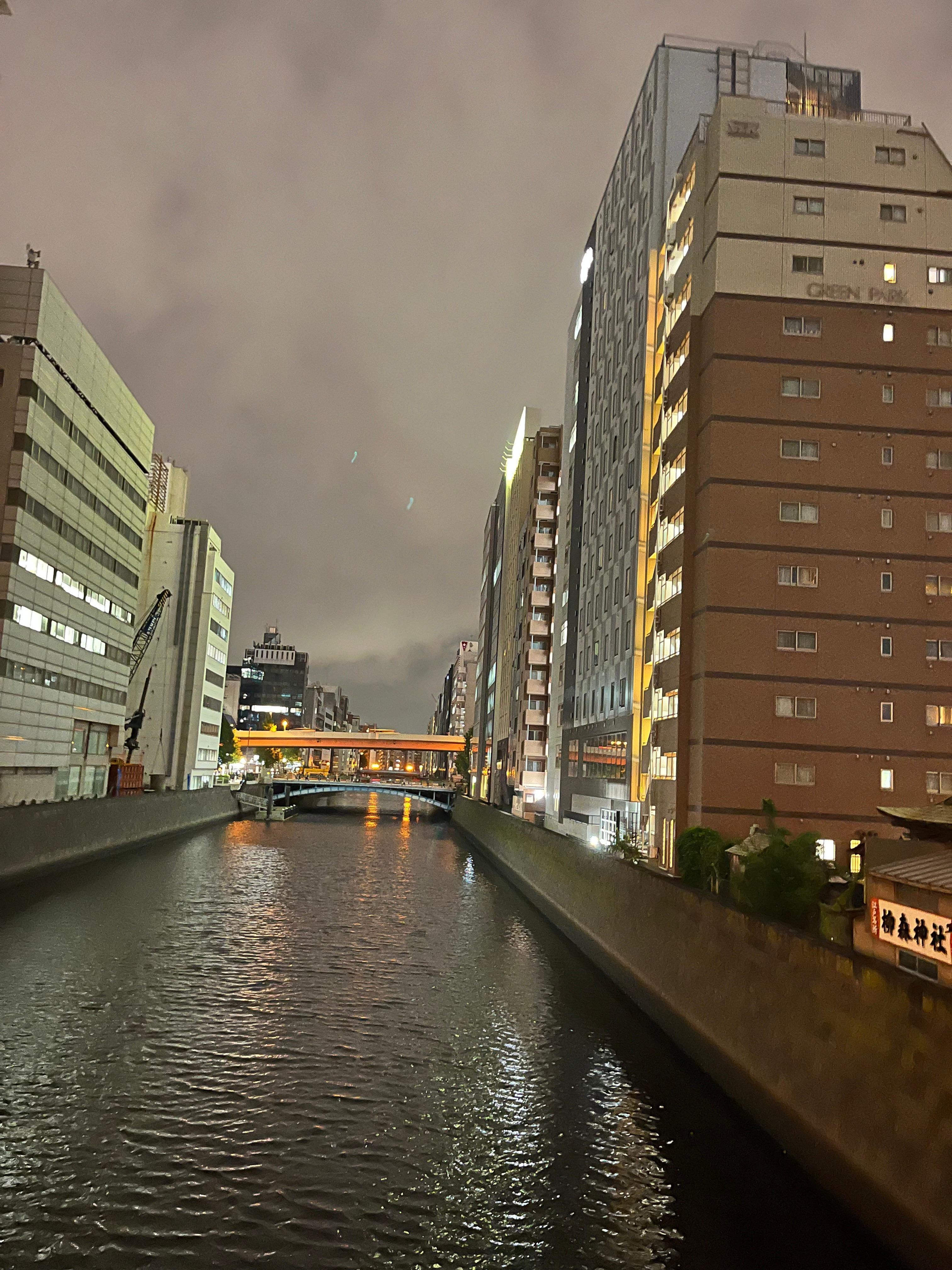 Walk over footbridge to shops and restaurants, train stations. 