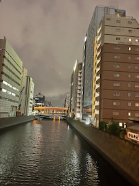 Walk over footbridge to shops and restaurants, train stations.