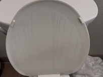 The condensation on the toilet seat lid.