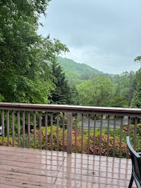 Standing in double door opening off main room looking outside to front porch and view.