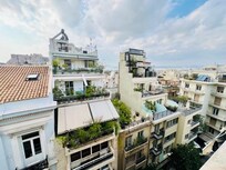View from the wonderful balcony. You can see the acropolis in the upper left hand corner.
