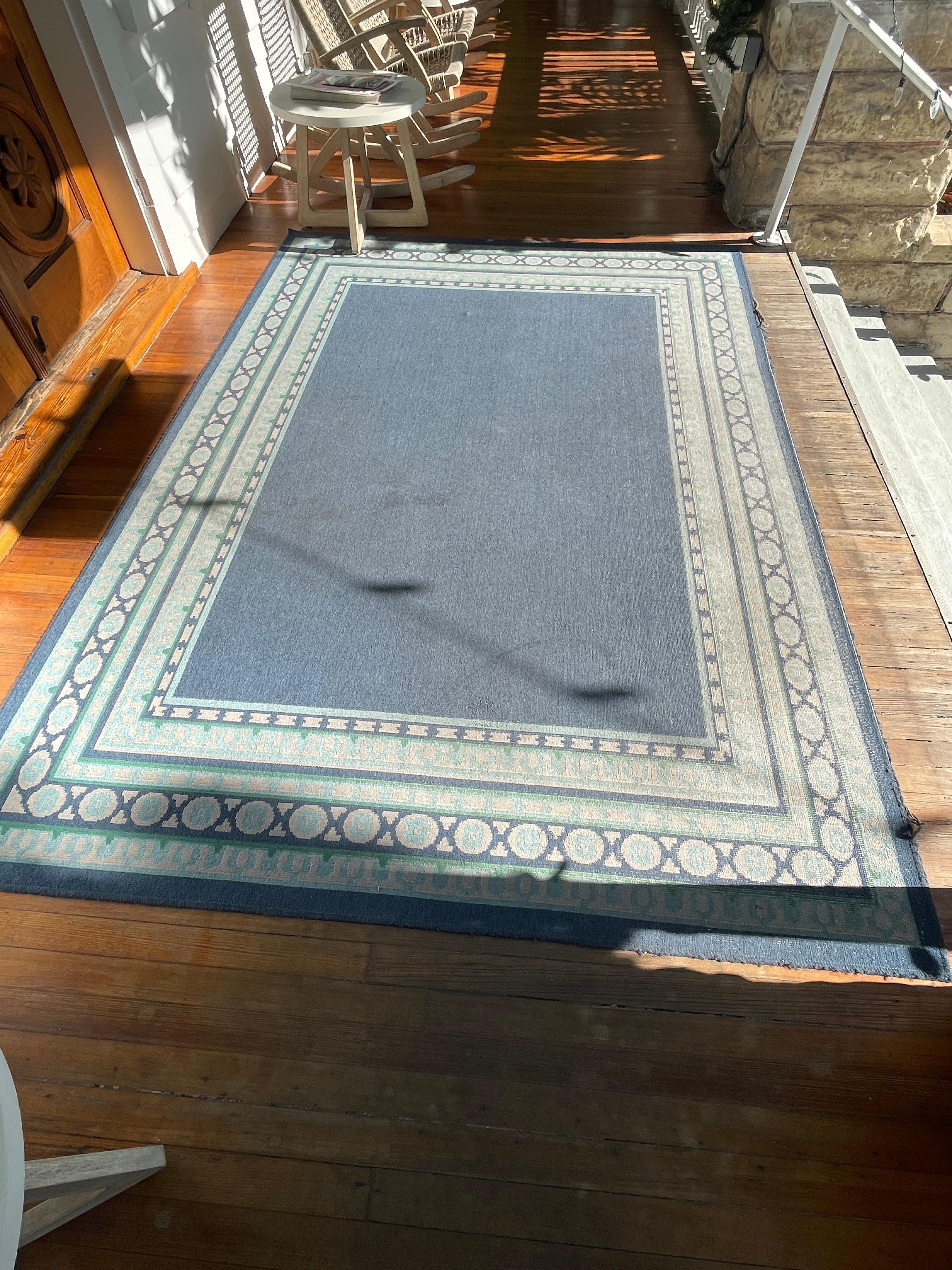 Front door rug - stained, torn - not a good first impression.