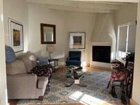 comfy living room with nice tv and fire place