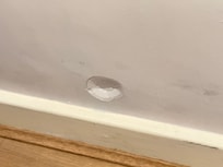 Dent in wall by bed 🙁