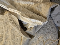 Only sheet and thin spread for bedding in 2 rooms.