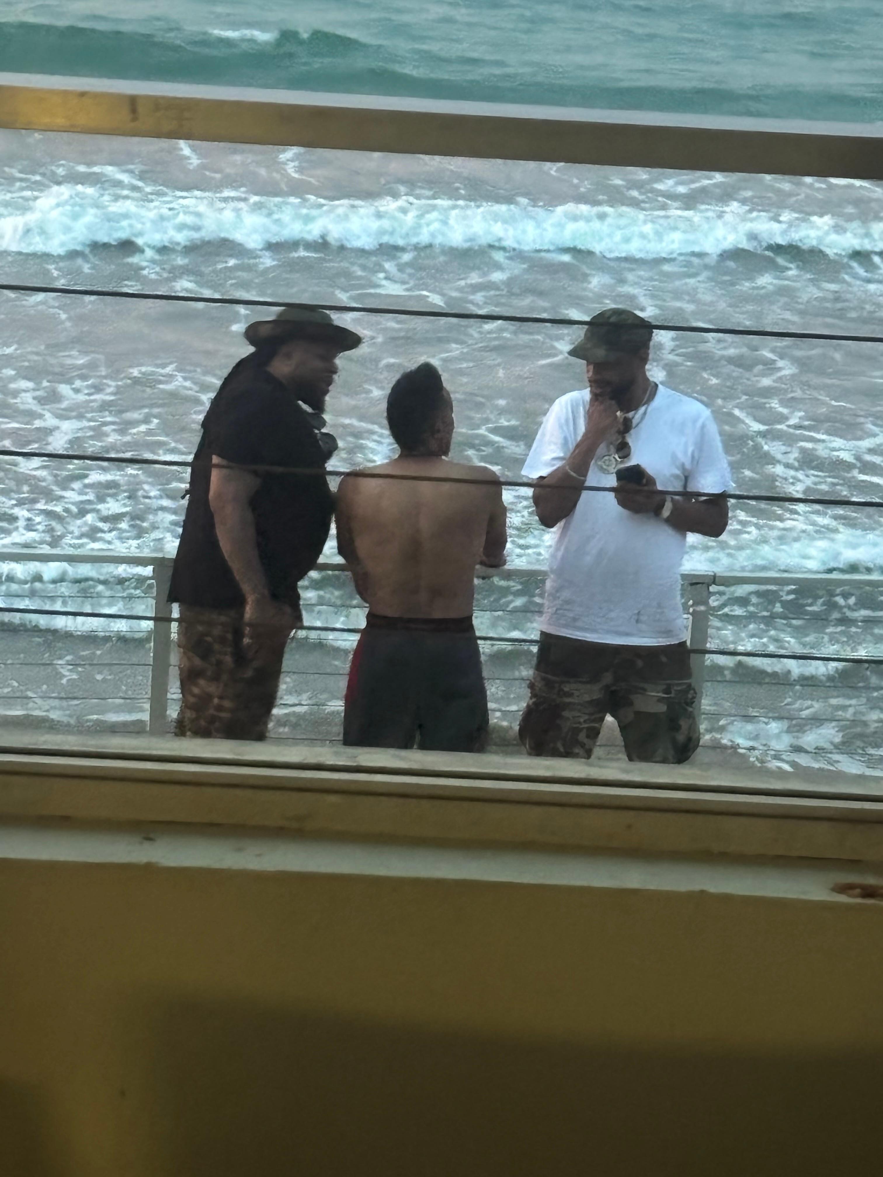 Looking at the fellas enjoying the view from the balcony