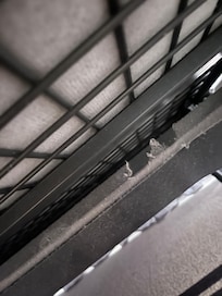 Under sofa bed (dropped pen & had to go under to find it)