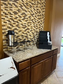 Coffee until 9; no coffee in the room as advertised.