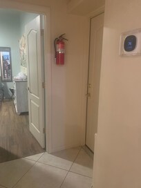 The open door is the bedroom that's right next the door of their side.
