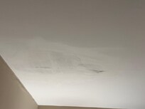 Ceiling where there had been a previous water leak.
