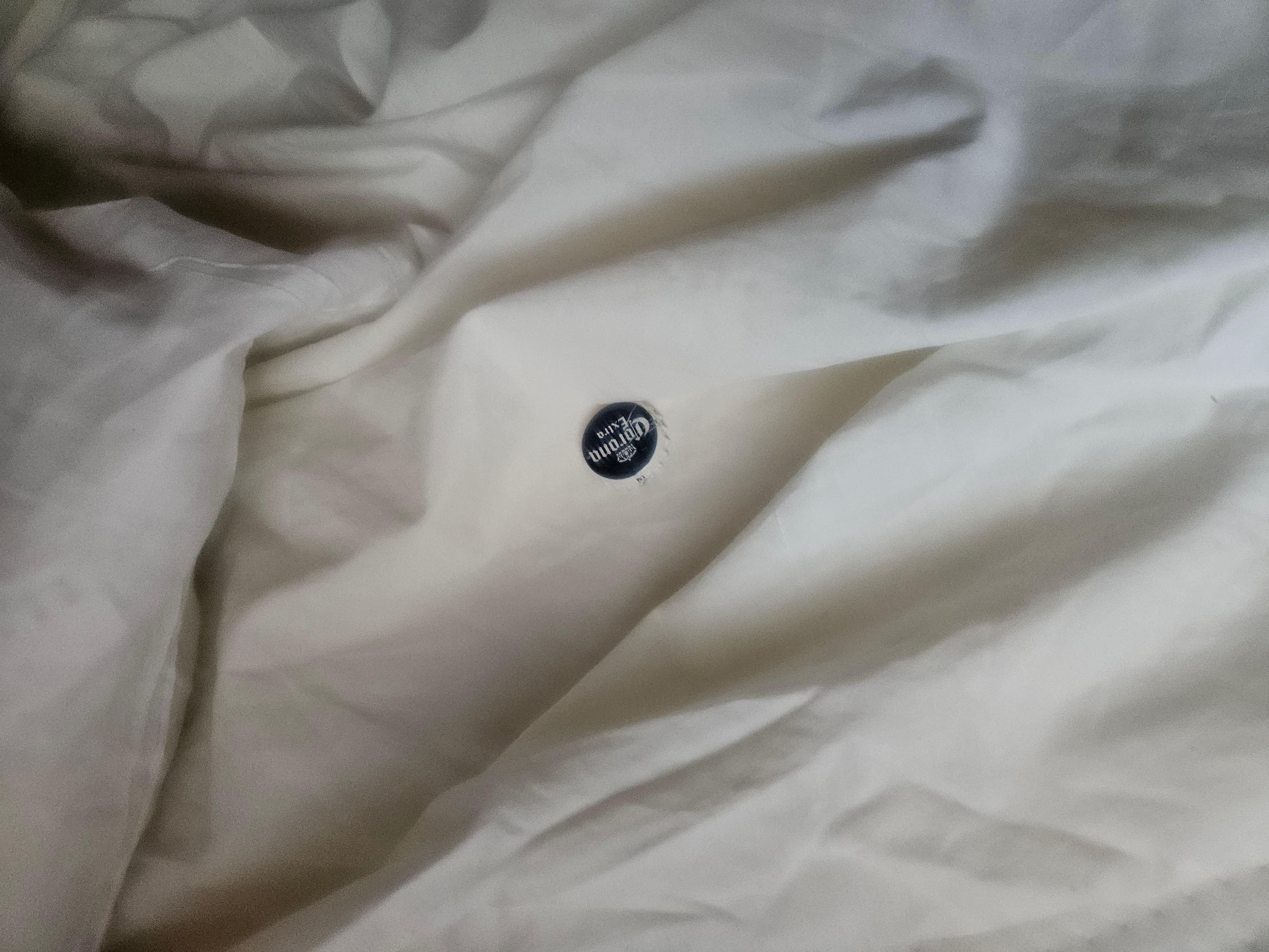 Beer cap in son's bed roll after cleaners changed them out