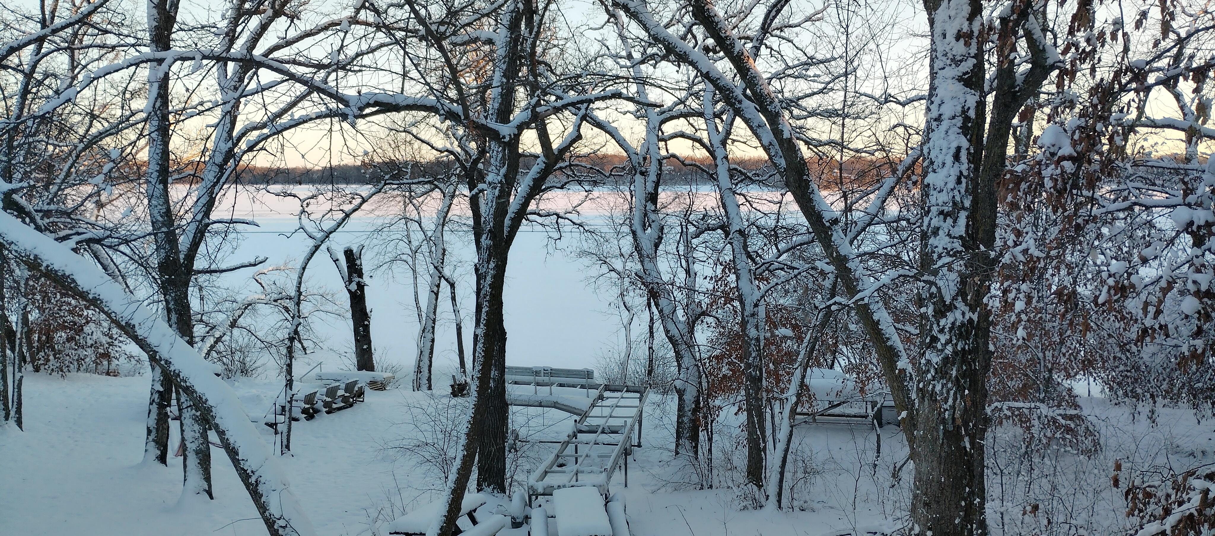 View out the back window facing the lake at sunset.
