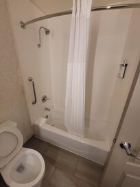 The water pressure was a bit weak and there is no shower head wand. But it gets the job done. Has a no slip pad.