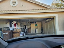 Garage full of items, barely room to park car (compare to listing pics)