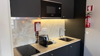 Fridge, microwave, range, dishes, espresso, tea kettle etc
