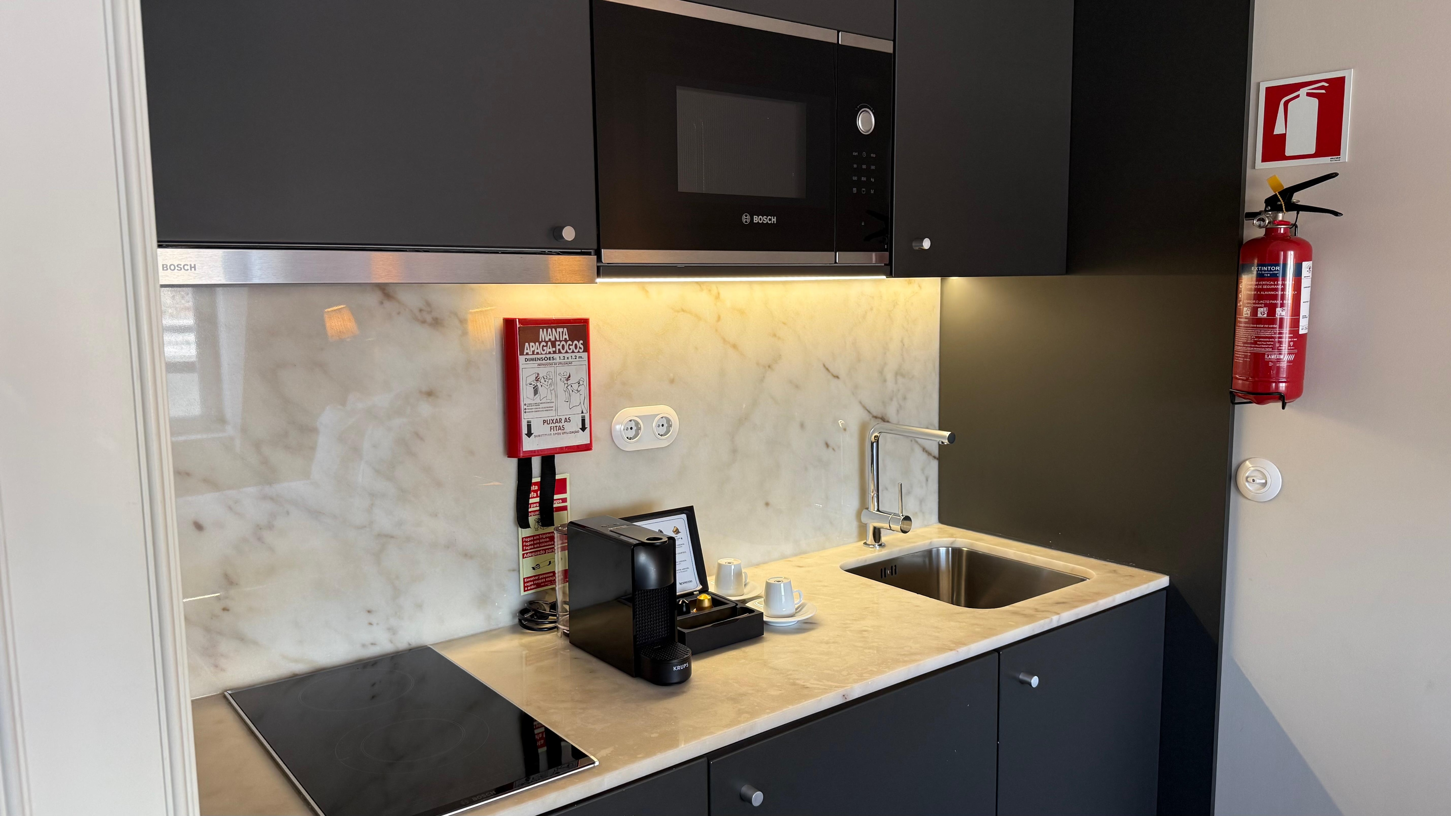 Fridge, microwave, range, dishes, espresso, tea kettle etc