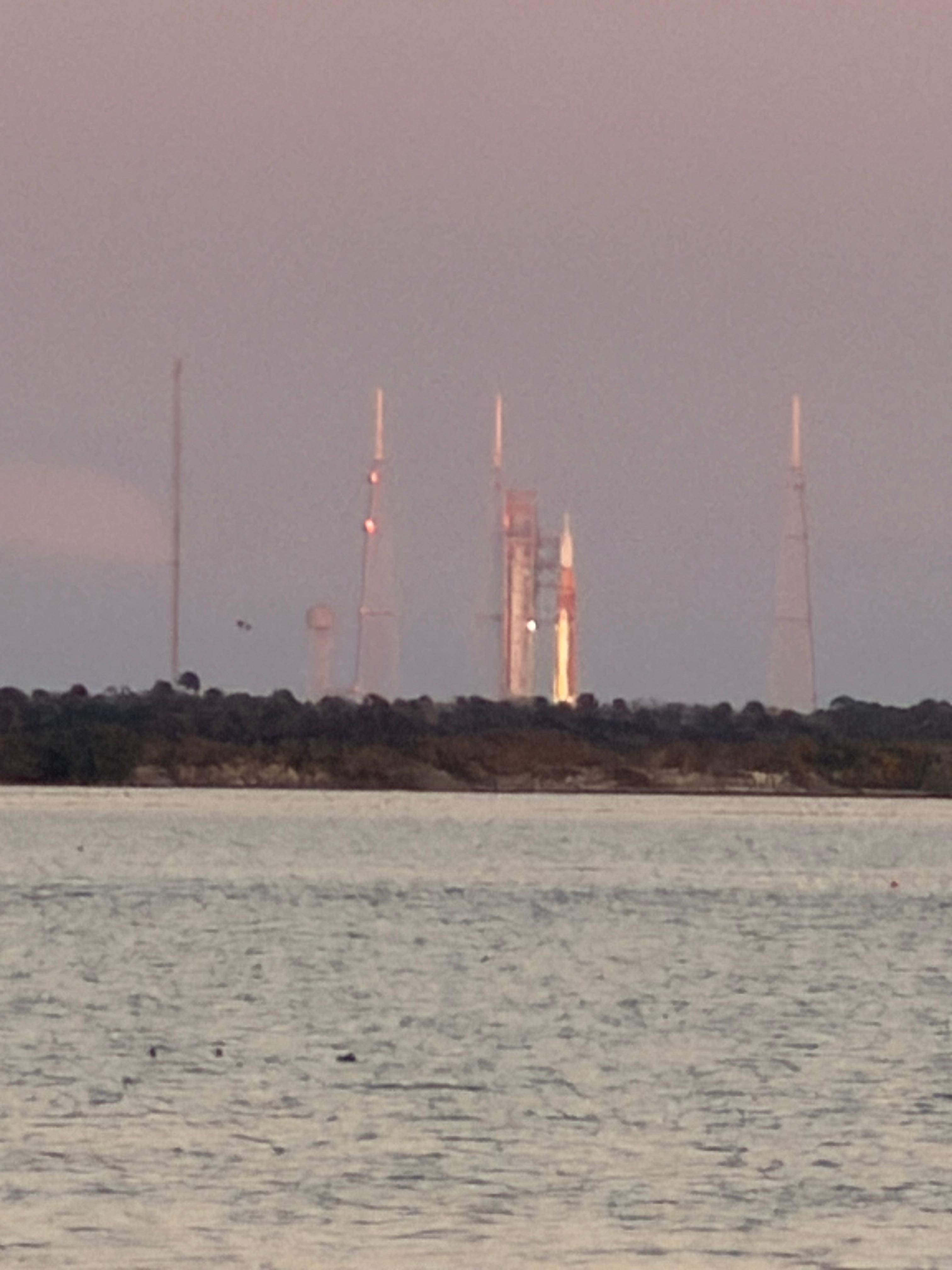 Artemis II zoomed view from behind the parking lot