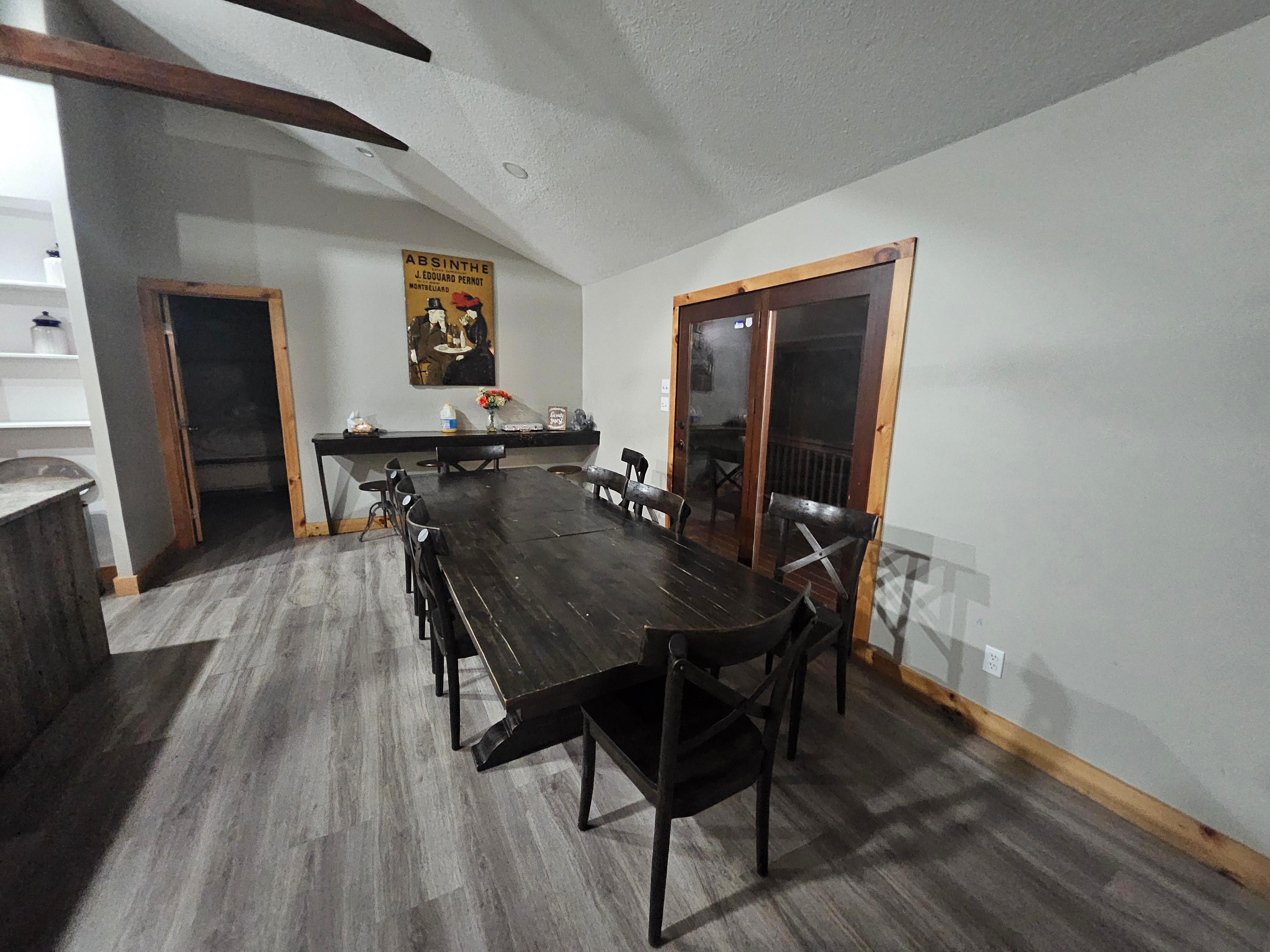 Between this dining table and the living room, we were able to enjoy meals together 