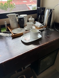 they did not wash the dishes or clean the cups or reset the coffee display