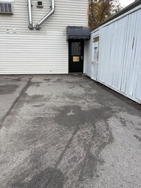 Black door to the annexe building, from the car park, where our room was located.