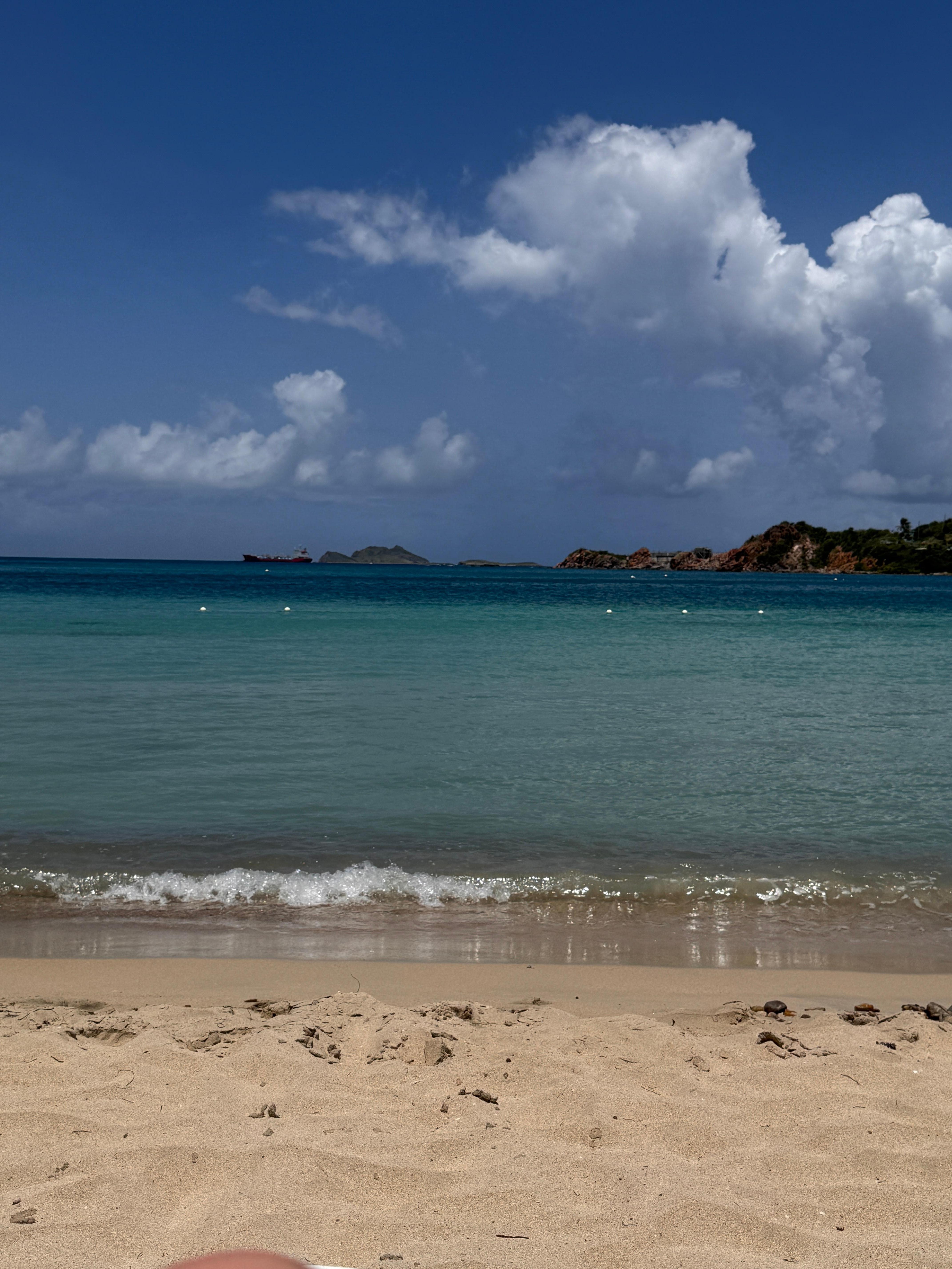 The waves never got big. Even during high tide they were still small. The weather was 80s and windy every day ( it was like a dream). It did have a sun shower a few times but then it went right back to normal.