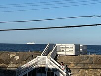 View from balcony overlooking ocean.